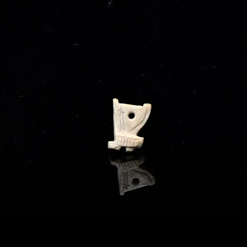 Late Period Bone Amulet Shaped as the Red Crown of Lower Egypt (ca. 664–332 BCE)